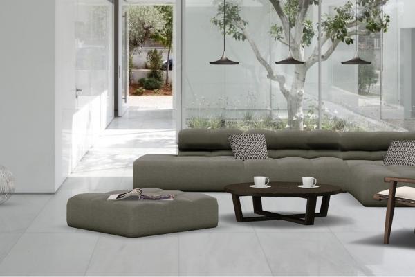 beautiful-minimalist-living-room-design-ideas-presenting-cleanly-white-wall-palette-and-seamless-white-ceramic-tiles-floor-fitted-with-striking-grey-sectional-sofas-feat-round-wooden-coffee-table-inco.jpg